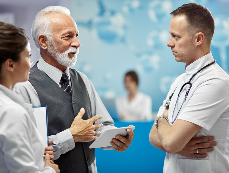 Doctors talking in a group.